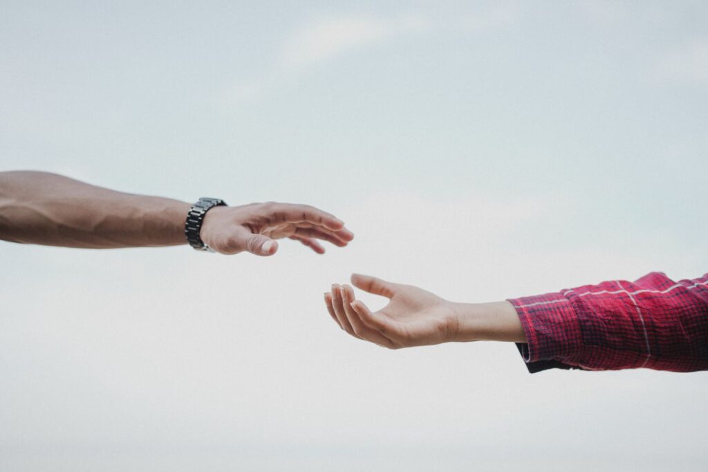 pexels photo 19894154 19894154 Two hands reaching towards each other, symbolizing connection and support.